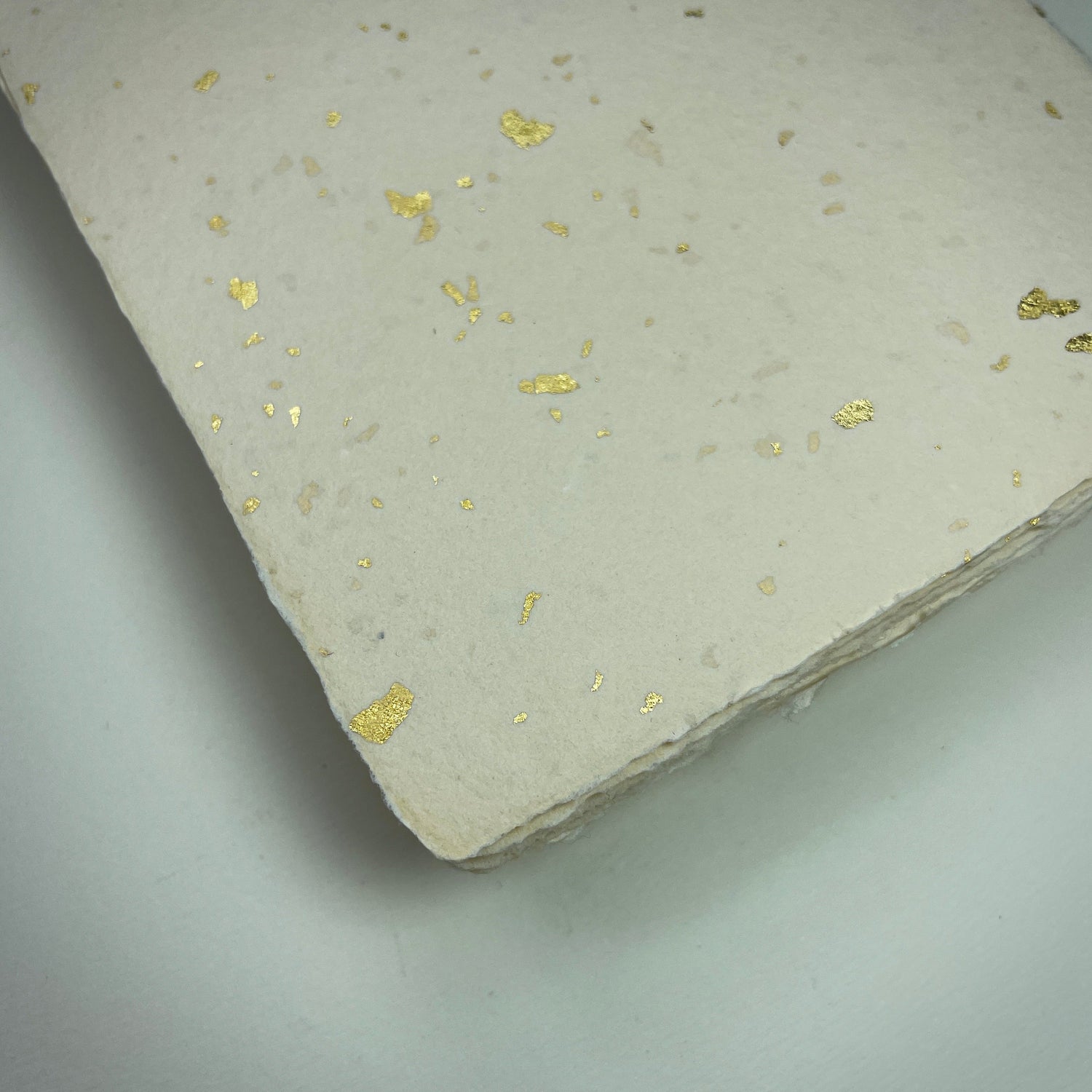 Büttenpapier elfenbein Goldflocken